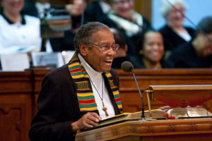 Resident Sister Antona Ebo stands at a podium, speaking about civil rights